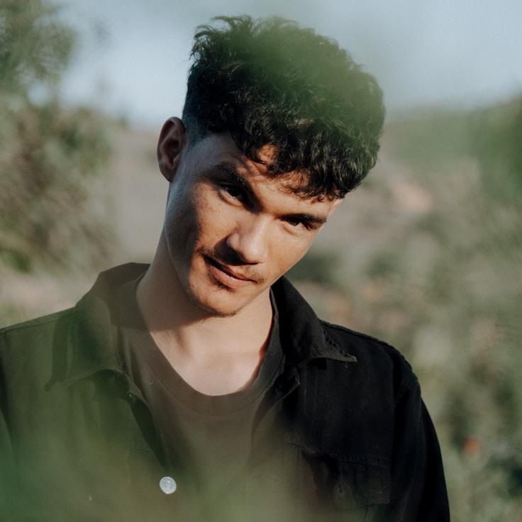 Kaveri Mehta, Lead Design Curator at GlideStudioSteep, reviewing corporate floral arrangements